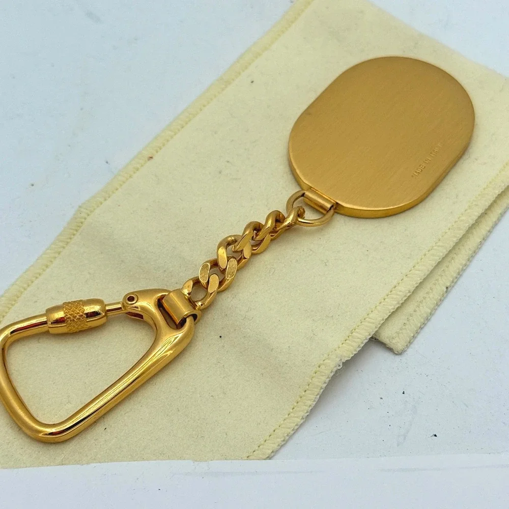 Dunhill Made in Italy Gold-Tone & Black Textured Leather Oval Keychain Key Fob‎